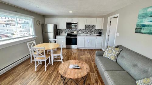 a living room with a couch and a table at Marguerite Motel in Hampton