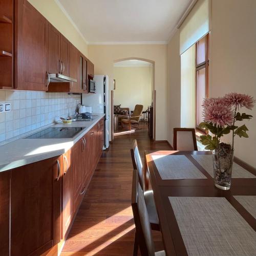 a kitchen with a table and a dining room at Apartmány Bašta & Wellness in Sušice