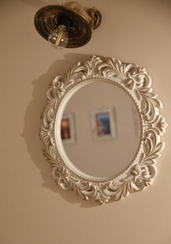 an ornate mirror hanging on a wall at Shining Star Petra in Petra