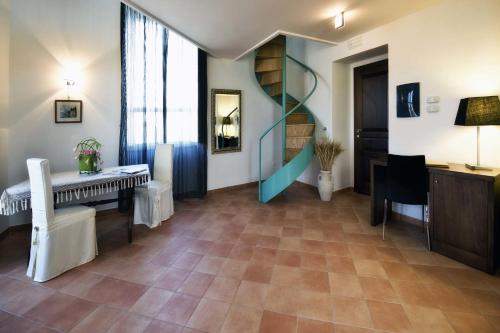a living room with a piano and a table at Relais Villa Buonanno in Cercola