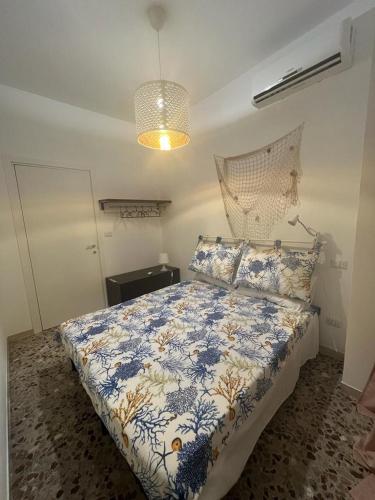 Säng eller sängar i ett rum på LA CASA DI GIOVANNI