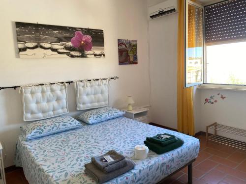 Postel nebo postele na pokoji v ubytování B&B Giglio Marino