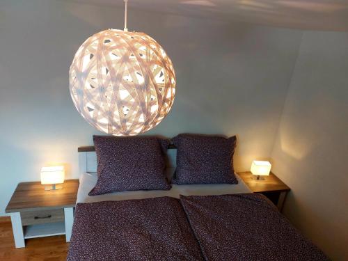 Una cama o camas en una habitación de Panoramatický apartmán Tatry