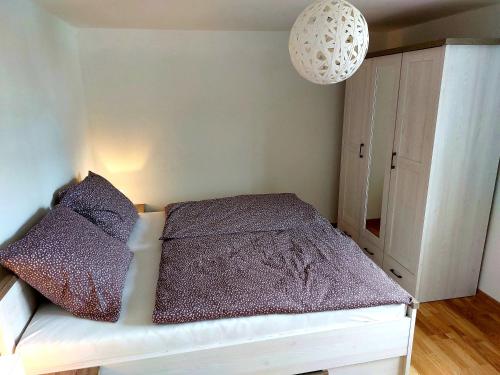Una cama o camas en una habitación de Panoramatický apartmán Tatry