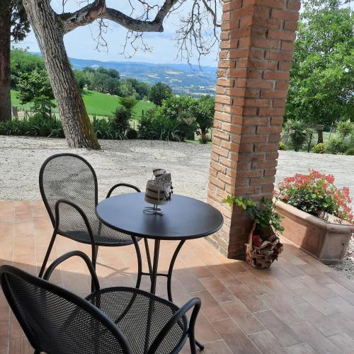 a table and chairs sitting on a patio at Agriturismo Il Truffarello TODI in Todi