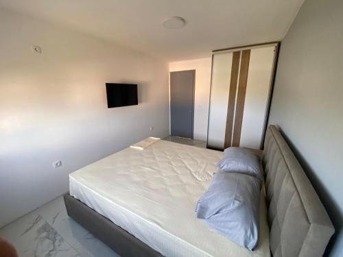 Ένα ή περισσότερα κρεβάτια σε δωμάτιο στο Etna Apartments