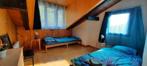 Кровать или кровати в номере Grand chalet 6-8 personnes, ski et randonnées