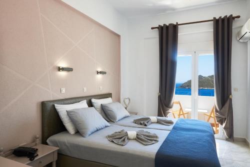Postel nebo postele na pokoji v ubytování HOTEL ATHINA