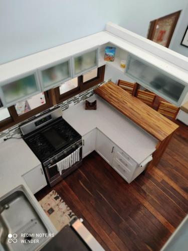 an overhead view of a kitchen with a stove at Green House by W. in Heredia