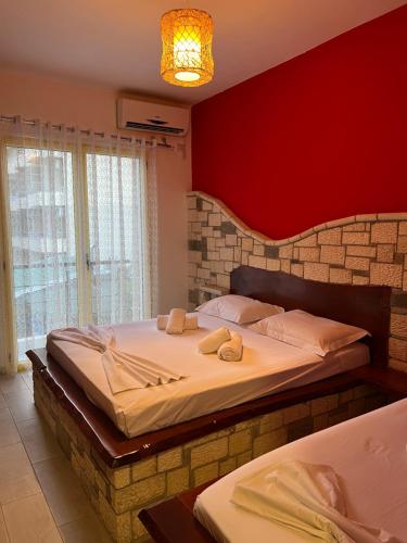 Krevet ili kreveti u jedinici u okviru objekta Hotel Adriatik Orikum