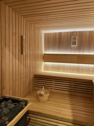 a sauna with a basket on a wooden floor at Villa Žnjan in Split