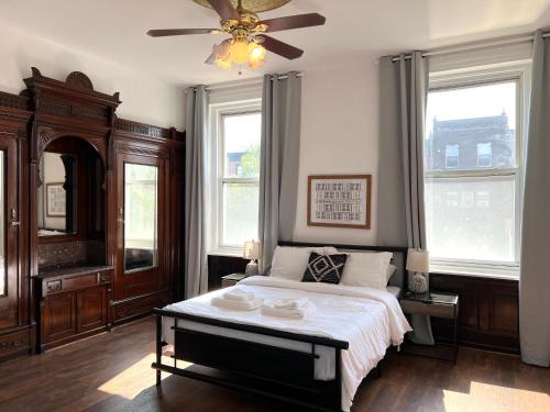 a bedroom with a bed and a ceiling fan at Alina & Fanny - Philadelphia S Broad St in Philadelphia