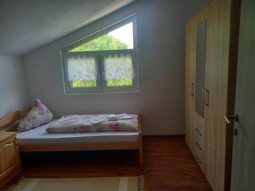 Cama ou camas em um quarto em Apartman EDINA