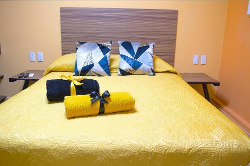 a bed with bows of presents on it at Condominio Brillante GDL in Guadalajara
