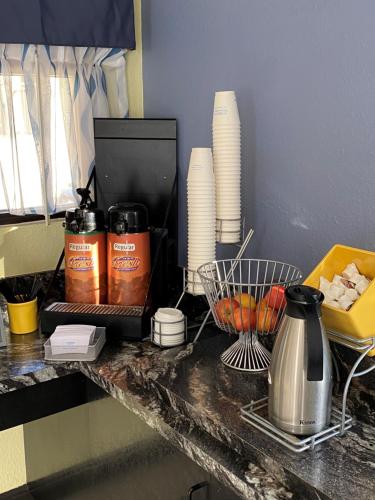 a kitchen counter with a coffee maker and a blender at Days Inn by Wyndham Lake City I-10 in Lake City