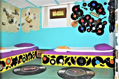 a room with two beds and a frisbee on the floor at Social Guest House in Sofia