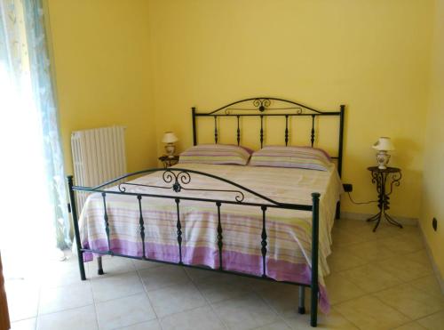 En eller flere senge i et værelse på APPARTAMENTO ILLIRIA