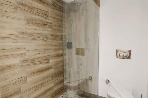 a bathroom with a shower and a toilet at Teos Ormanci Tatil Koyu in Seferihisar