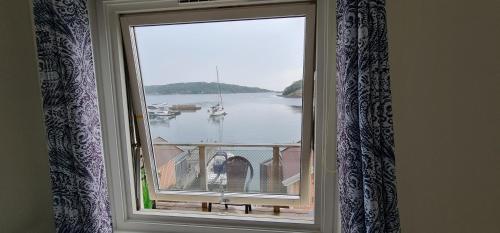 a window with a view of a body of water at Marinan Richters in Fjällbacka