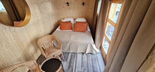 a small room with a bed and a window at Marinan Richters in Fjällbacka