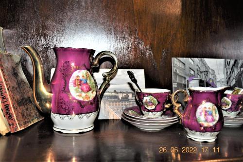 a group of three vases sitting on a shelf at Social Guest House in Sofia