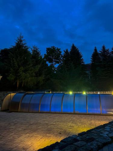 a building that is lit up at night at Resort LUFT Sněžník in Sněžnik