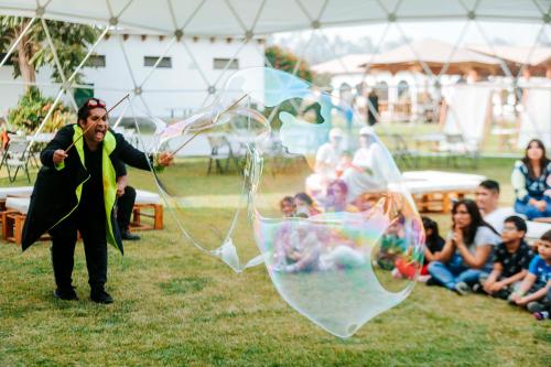 a man is flying a large bubble kite at VPX Hoteles Cieneguilla in Cieneguilla