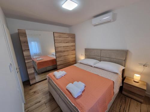 Postel nebo postele na pokoji v ubytování Apartman Lovre