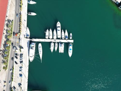 an aerial view of a dock with boats in the water at La Grande Apartments in Kotor