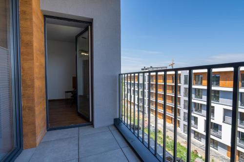 a balcony with a view of a building at Apartament No82 Yellow Holiday Home Zator in Zator