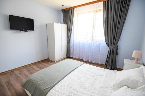 Postel nebo postele na pokoji v ubytování Guest House Dinaya