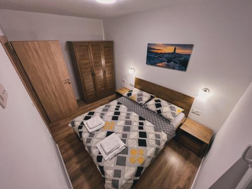 سرير أو أسرّة في غرفة في ZILIP Apartments