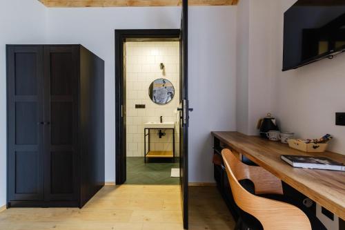 a room with a door and a table and chairs at Panocek i Babka in Białka Tatrzanska
