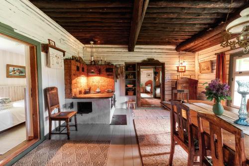 a large room with a kitchen with a stove at Matsi cottage in Igaküla