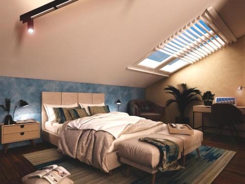 a bedroom with a large bed and a skylight at Boutique Hotel OchSen in Bad Ragaz