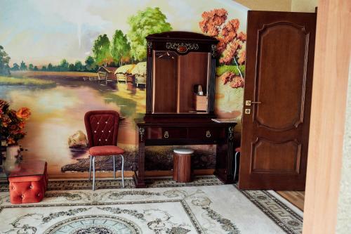 a room with a wall with a painting of a river at Santorini in Chişinău