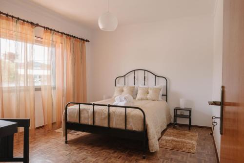 Ένα ή περισσότερα κρεβάτια σε δωμάτιο στο Casa Ti Carolina