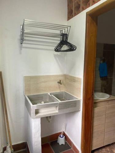 a bathroom with a sink and a toilet at Apartahotel Villa carolina 1 in Jericó