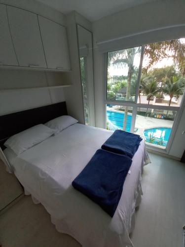 A bed or beds in a room at Temporada RJ Bora Bora Resort