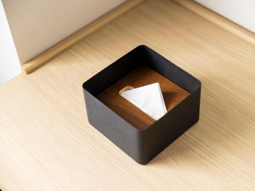 a black box with a piece of paper in it at Ariston Hotel Kyoto Jujo in Kyoto
