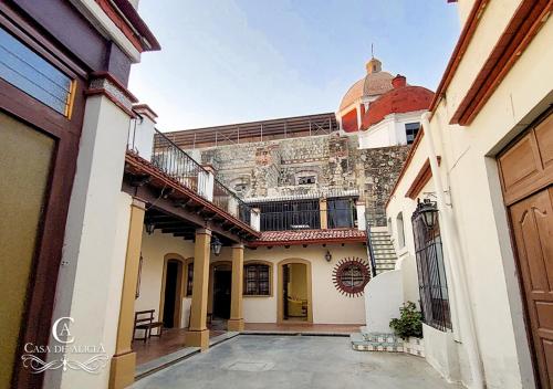 a courtyard of a house with a building at Casa de Alicia Departamento Yagul in Oaxaca City