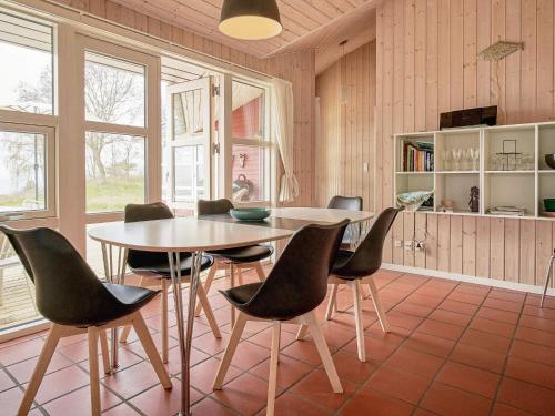 a dining room with a table and chairs at Luxury Retreat by the Sea - By Traum Ferienwohnungen in Vester Sømarken
