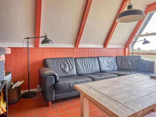 a living room with a couch and a table at Luxury Retreat by the Sea - By Traum Ferienwohnungen in Vester Sømarken