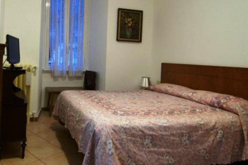 Ein Bett oder Betten in einem Zimmer der Unterkunft Le Stanze Di Nico