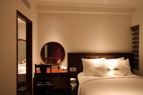 Cochin Sang Hotelにあるベッド