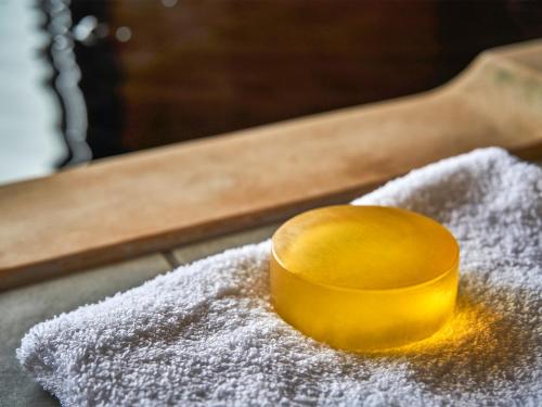 a yellow container sitting on top of a pile of sugar at Kameyama Onsen Hotel in Kimitsu