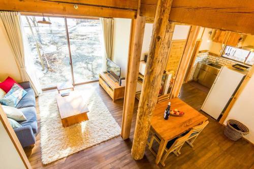 an overhead view of a living room with a table at Misorano Chalet in Hakuba