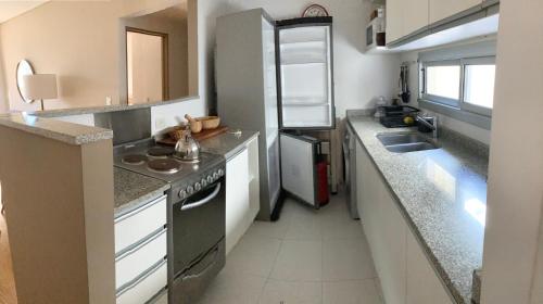 Una cocina o zona de cocina en Apartamento Smart