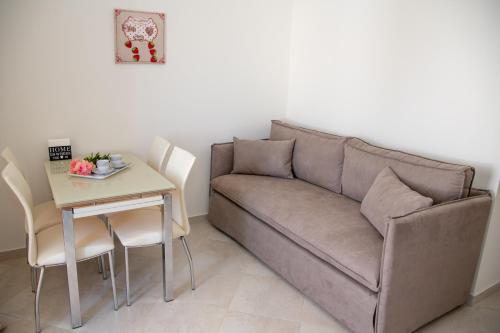a living room with a couch and a table at Naxian Place in Agios Prokopios