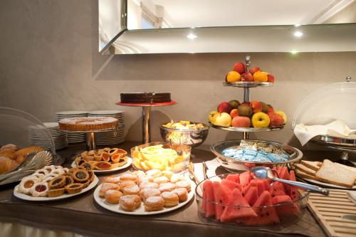 a buffet with many different types of food on a table at Hotel San Pietro in Verona